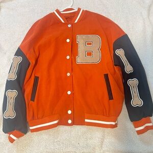 Orange button down letter patch two tone varsity jacket.